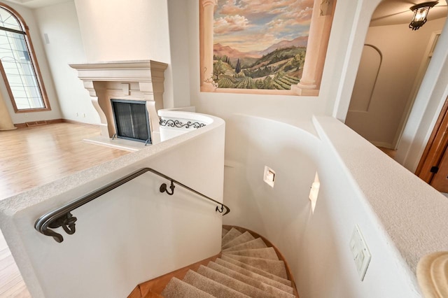 staircase featuring hardwood / wood-style floors