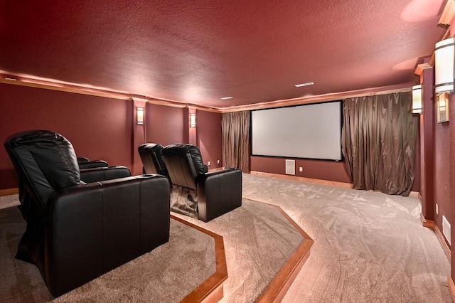 home theater with carpet, ornate columns, and a textured ceiling