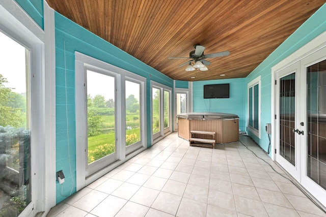 unfurnished sunroom with ceiling fan, french doors, a jacuzzi, lofted ceiling, and wood ceiling