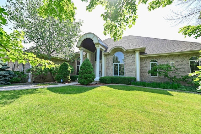 view of front of property with a front lawn