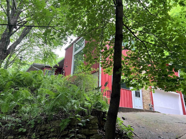 view of side of home with a garage