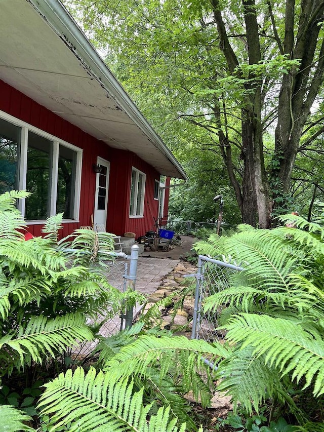 view of side of home with a patio area