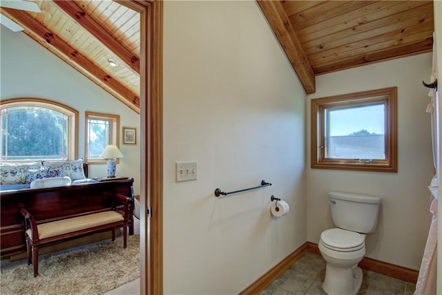 bathroom featuring vaulted ceiling with beams, toilet, and wooden ceiling