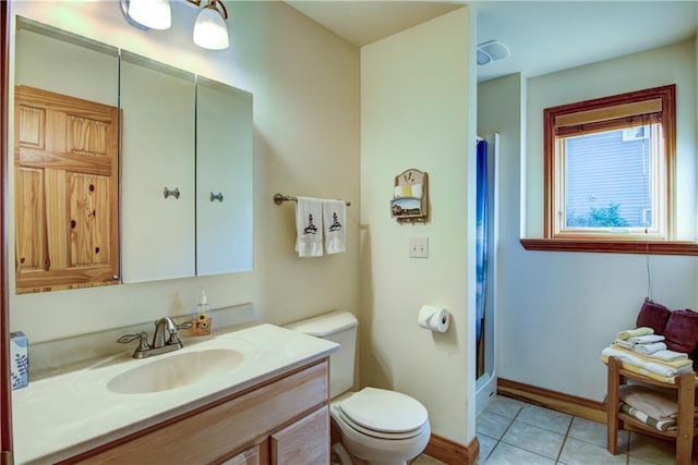 bathroom featuring a shower, tile patterned flooring, vanity, and toilet