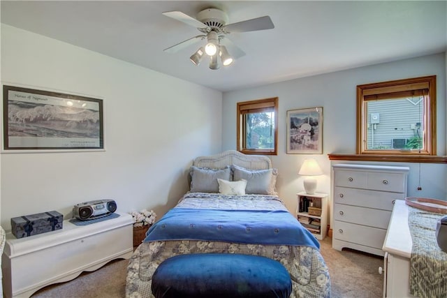 carpeted bedroom featuring ceiling fan