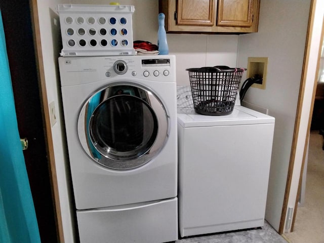 laundry room featuring washer and clothes dryer