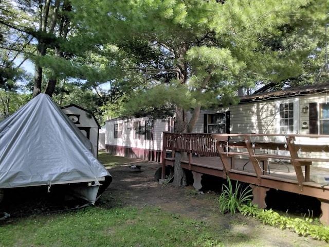 view of yard with a wooden deck