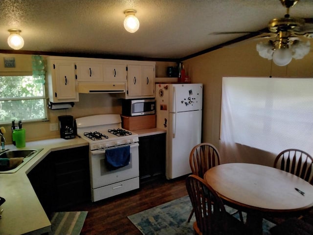 kitchen featuring a textured ceiling, white appliances, ceiling fan, sink, and white cabinets