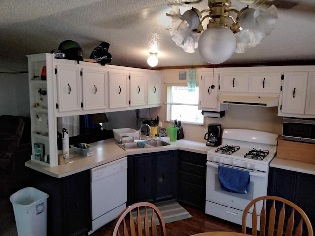 kitchen with white appliances, sink, a textured ceiling, dark hardwood / wood-style flooring, and white cabinetry