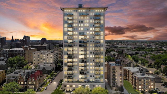 view of outdoor building at dusk