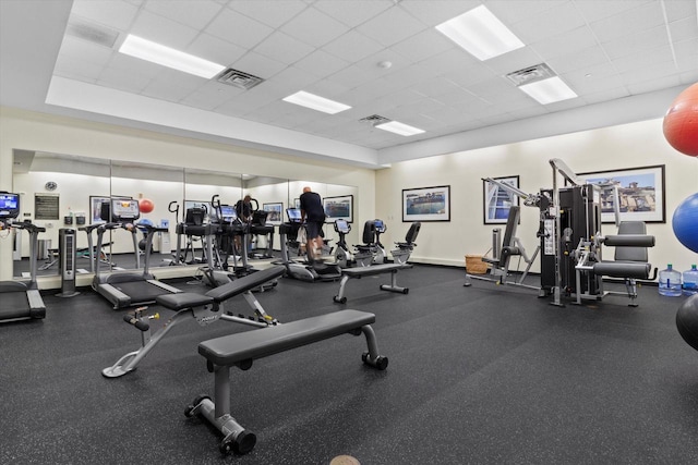 gym featuring a drop ceiling