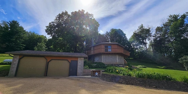 view of front facade with an outdoor structure and a garage