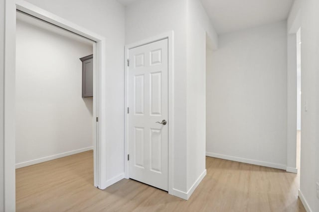 corridor featuring light hardwood / wood-style floors