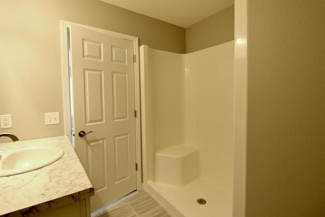 bathroom featuring vanity and walk in shower