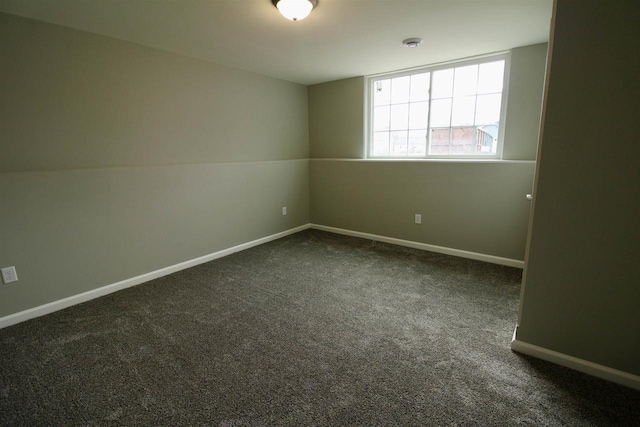 empty room featuring dark colored carpet