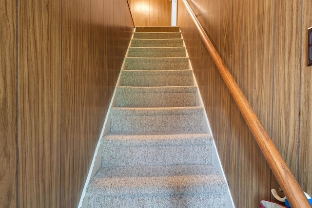 stairway with wooden walls