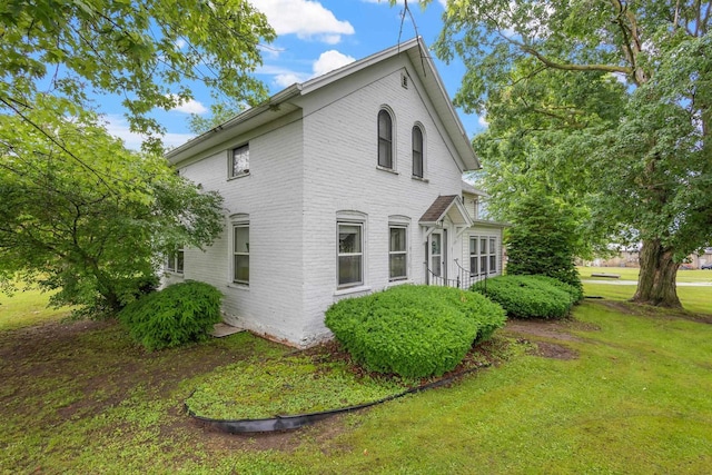 view of home's exterior featuring a yard