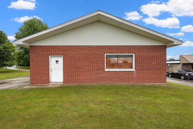 view of home's exterior with a yard