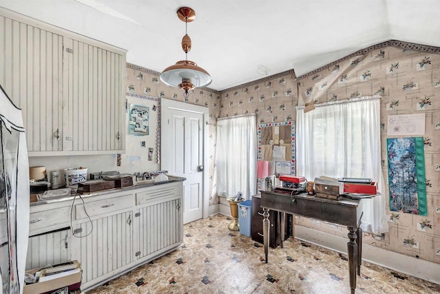 kitchen featuring lofted ceiling and decorative light fixtures