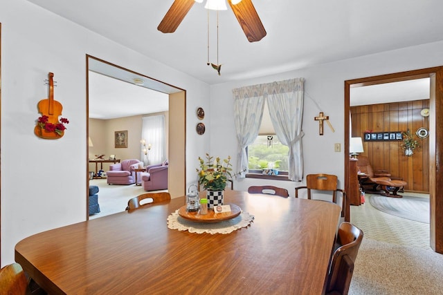 dining room with carpet flooring and ceiling fan