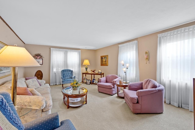 carpeted living room featuring a healthy amount of sunlight