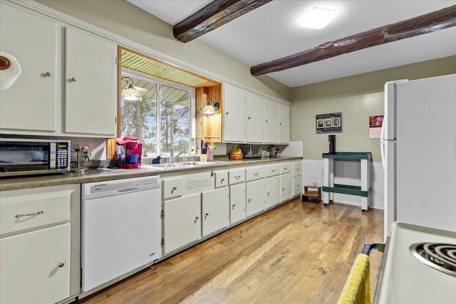 kitchen with white appliances, sink, beam ceiling, light hardwood / wood-style flooring, and white cabinets