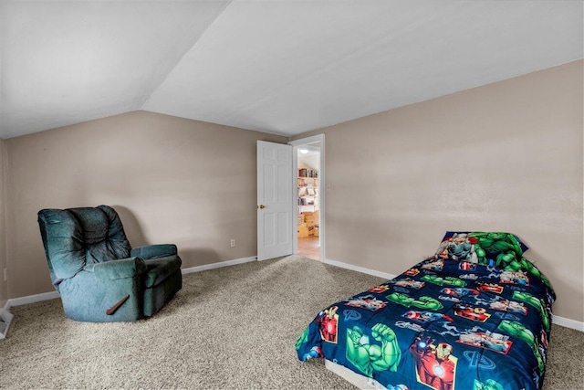 carpeted bedroom with vaulted ceiling