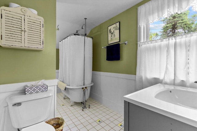 bathroom featuring tile patterned floors, vanity, and toilet