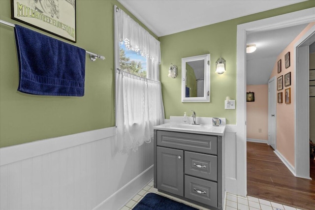 bathroom featuring tile patterned flooring and vanity