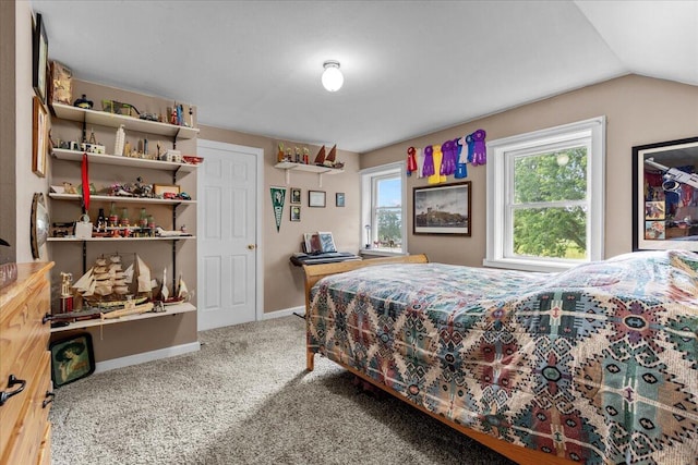 carpeted bedroom featuring vaulted ceiling