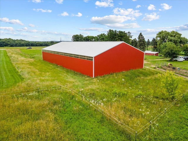 view of outdoor structure with a rural view