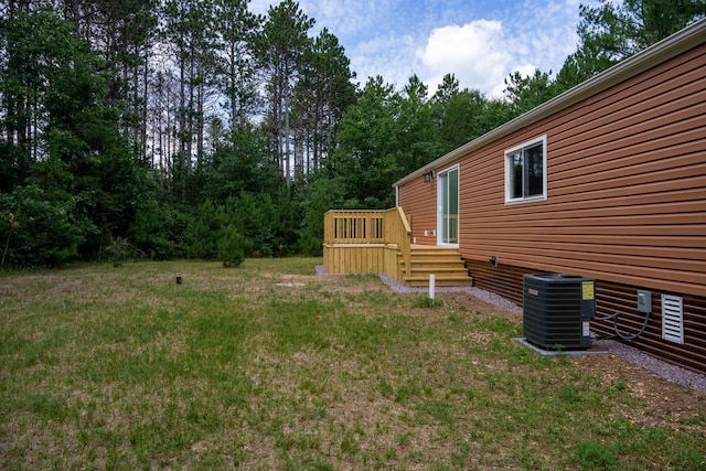 N9351 Juneau Ln, Necedah, WI 54646 - view of yard with cooling unit and a wooden deck