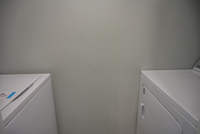 N9351 Juneau Ln, Necedah, WI 54646 - washroom featuring washing machine and dryer