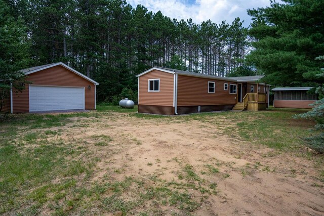 N9351 Juneau Ln, Necedah, WI 54646 - view of yard with an outdoor structure and a garage