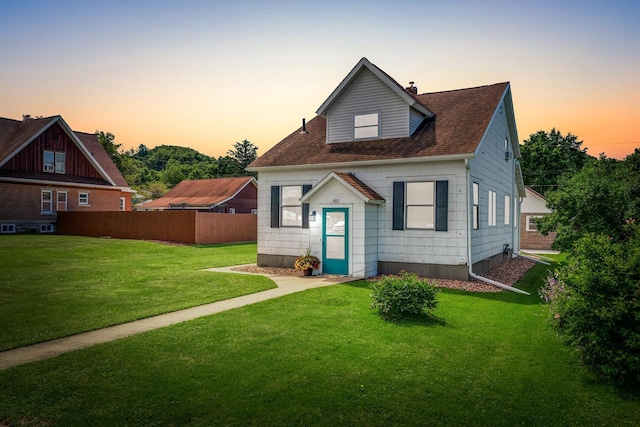 view of front of home featuring a lawn