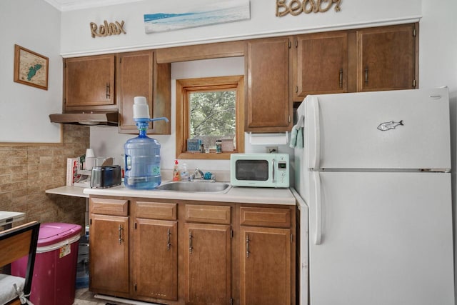 kitchen with white appliances and sink