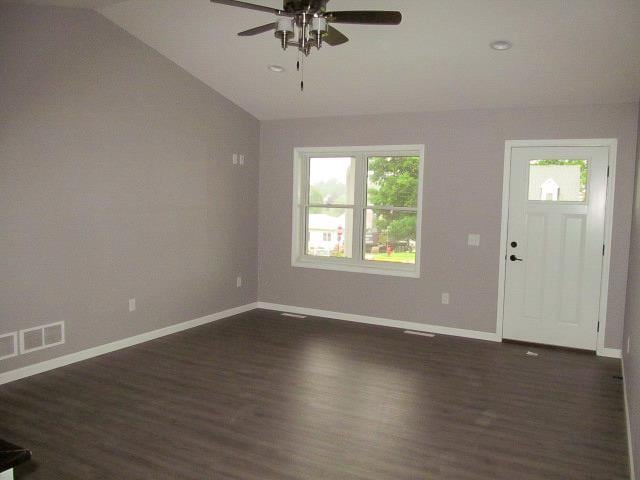 entrance foyer with ceiling fan, dark hardwood / wood-style flooring, and lofted ceiling