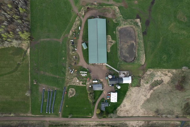 birds eye view of property with a rural view