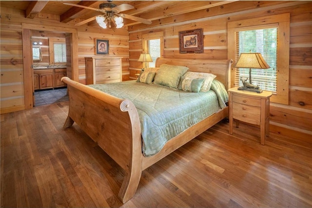 bedroom featuring wood ceiling, ceiling fan, log walls, beam ceiling, and dark hardwood / wood-style floors