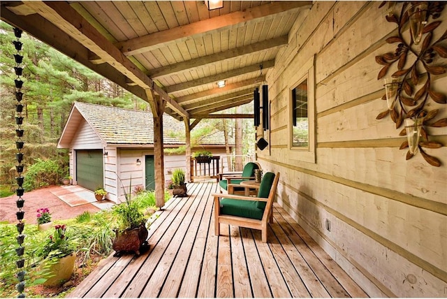 deck featuring a garage and an outdoor structure