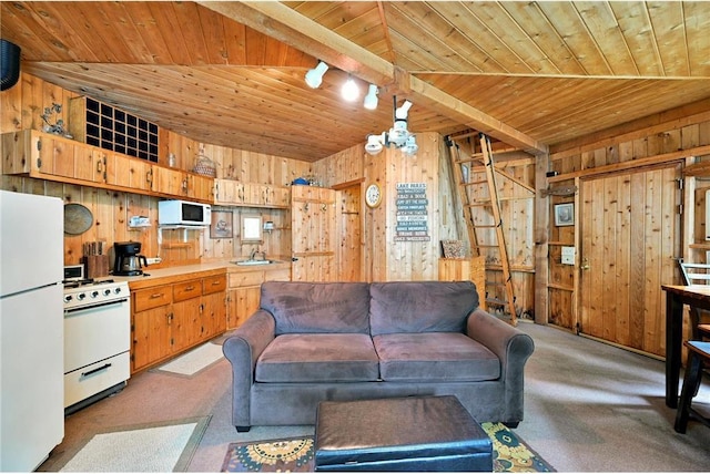 living room featuring wood ceiling, wooden walls, and track lighting