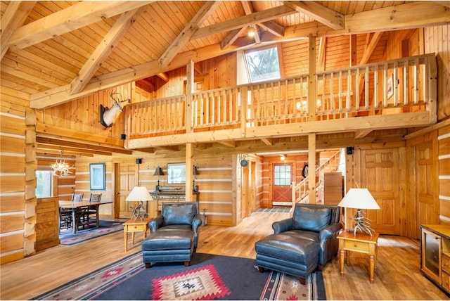 living room with beam ceiling, high vaulted ceiling, wood ceiling, and hardwood / wood-style flooring