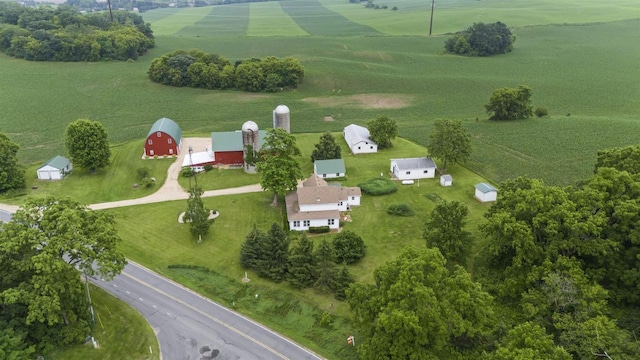 birds eye view of property with a rural view