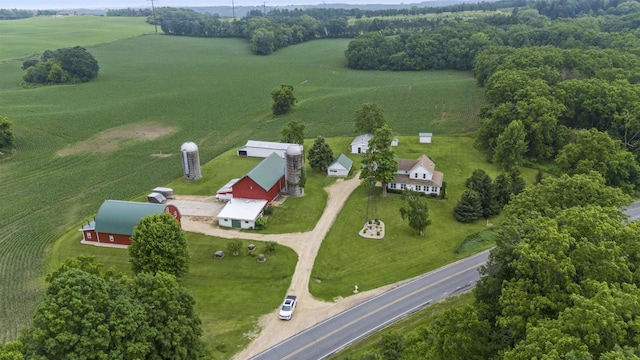 birds eye view of property with a rural view