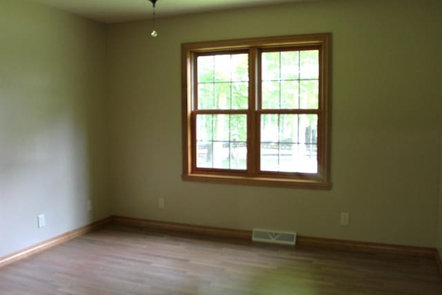 spare room featuring light hardwood / wood-style floors