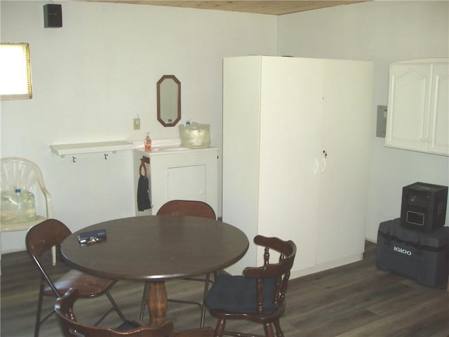 dining space with dark hardwood / wood-style flooring