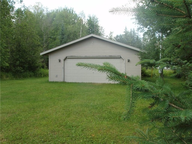 garage with a lawn