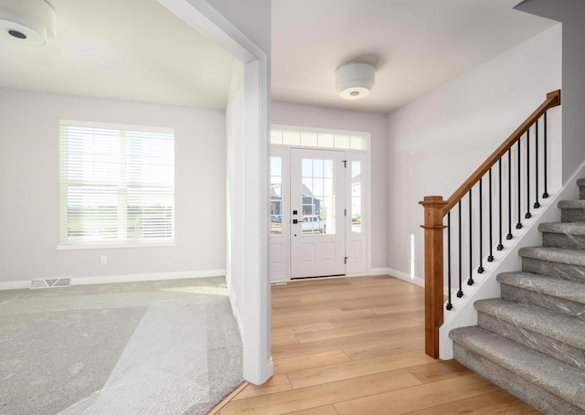 foyer with light hardwood / wood-style flooring