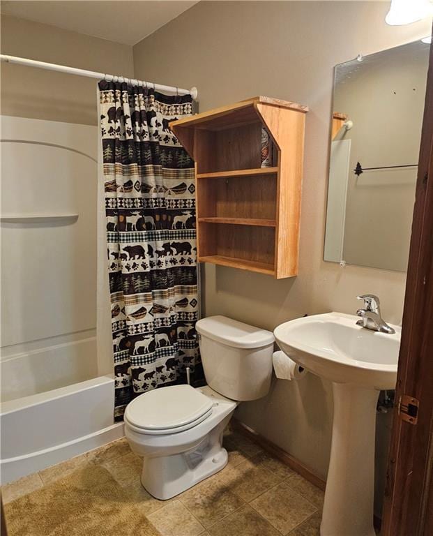 bathroom featuring toilet and shower / tub combo with curtain