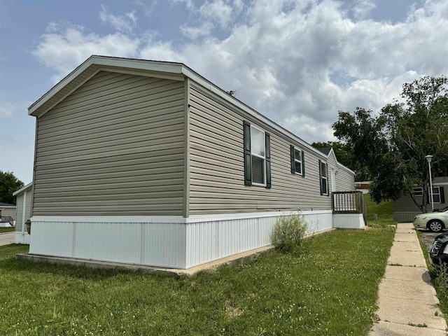 view of home's exterior with a lawn